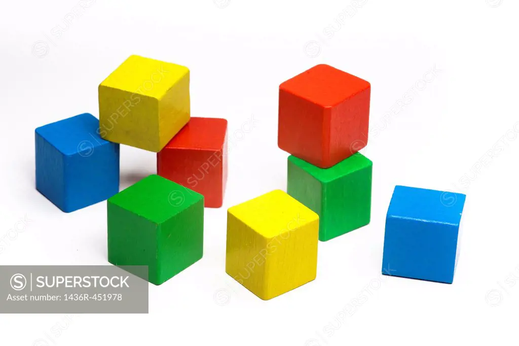 color cubes lying randomly from kids play.