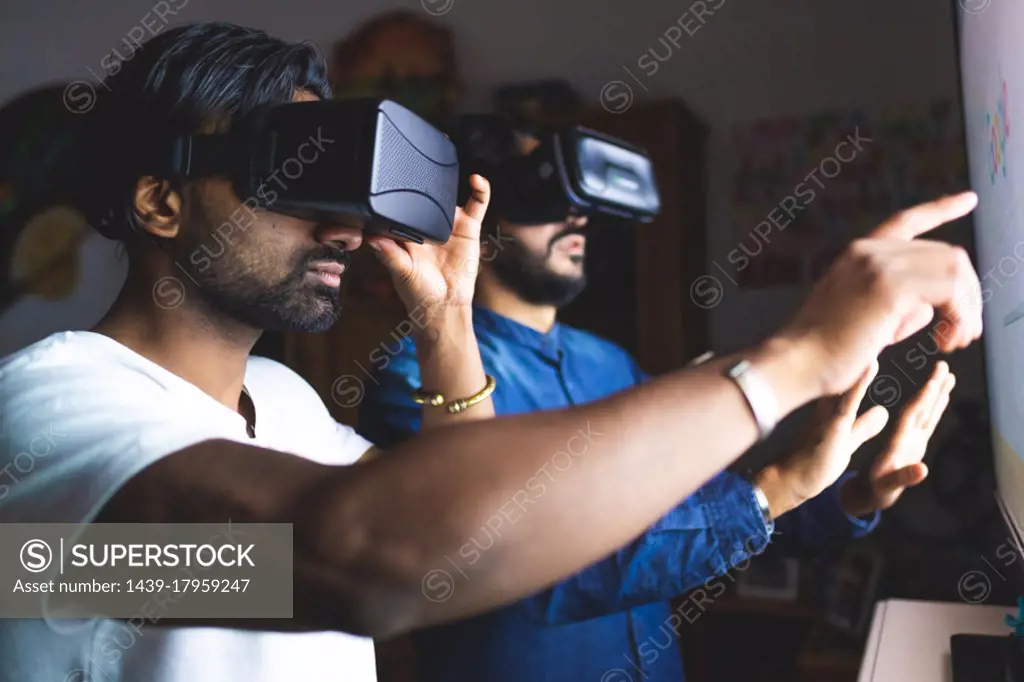 Men using virtual reality headsets