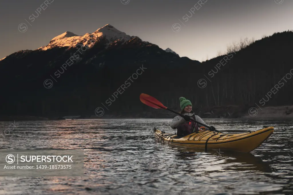 Canada, British Columbia, Woman kayaking in Squamish River