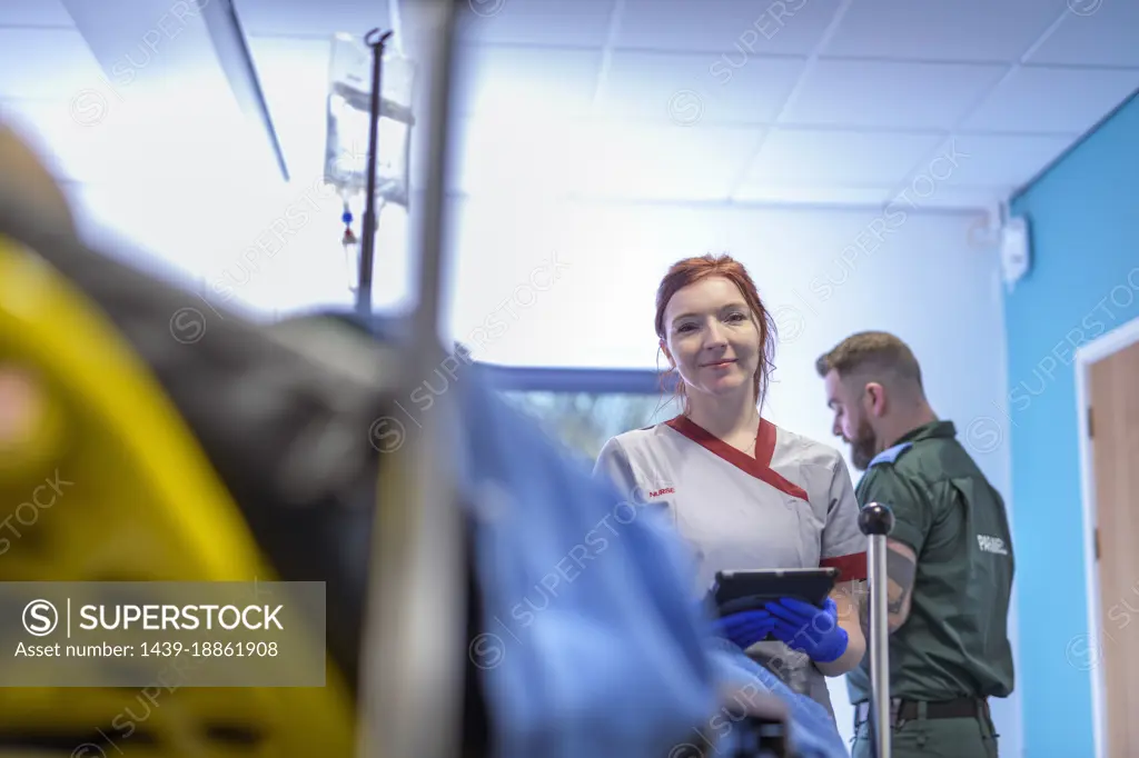 Portrait of emergency nurse with paramedic in accident and emergency hospital