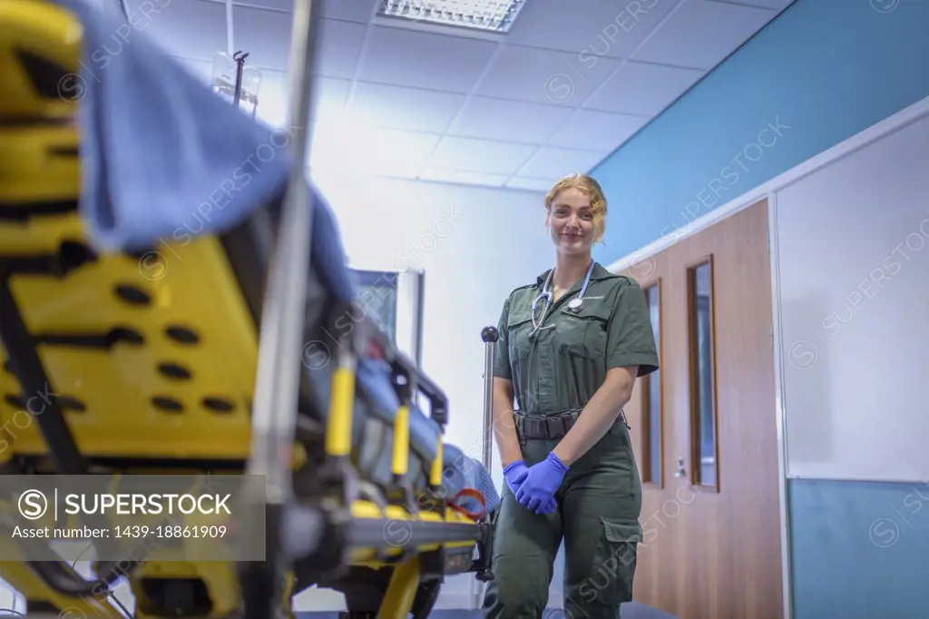 Portrait of emergency female paramedic in accident and emergency hospital