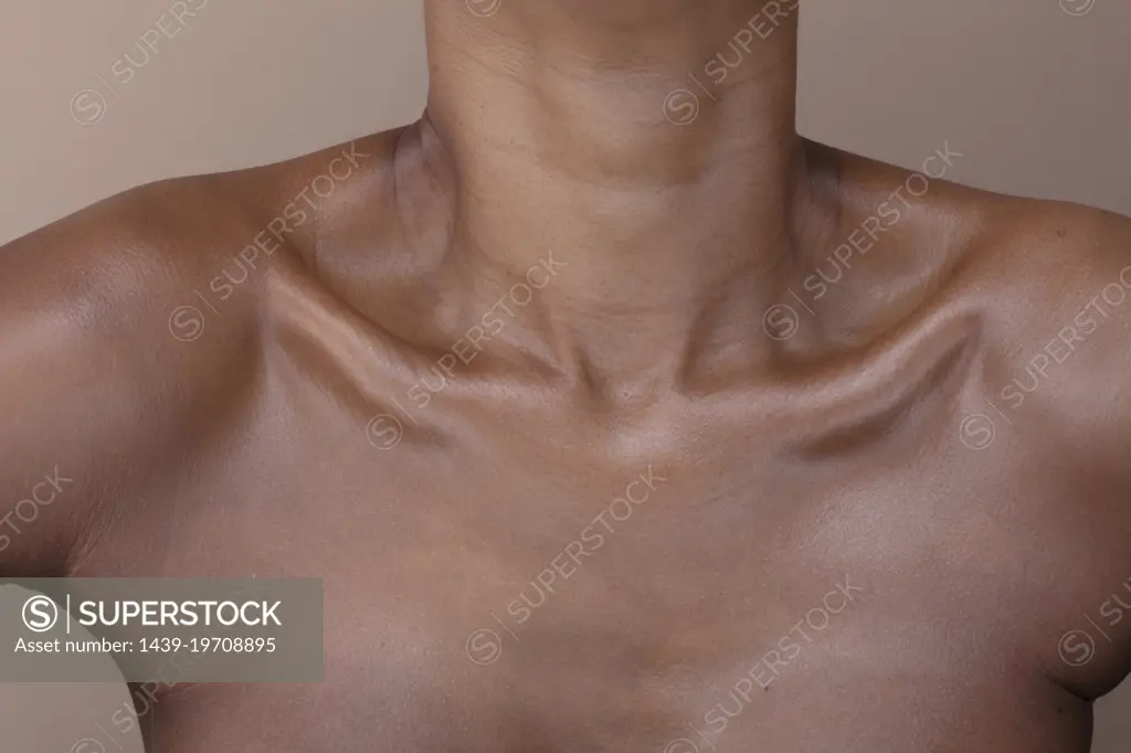 Close-up of shirtless woman's chest