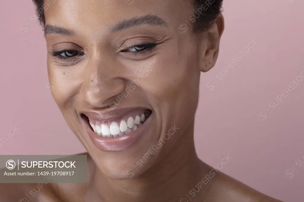 Studio shot of smiling woman