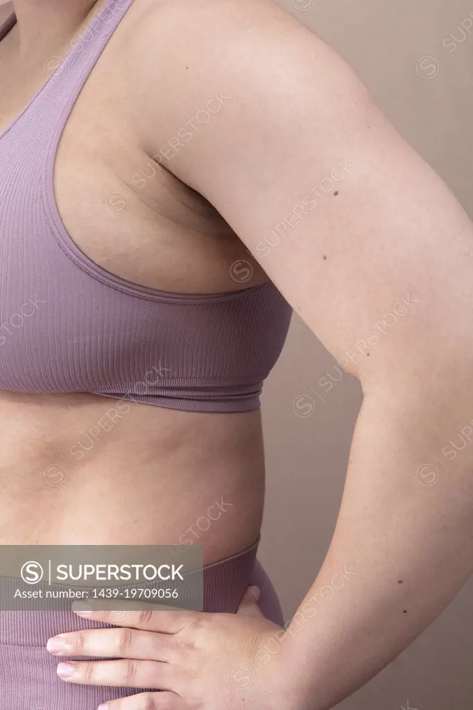 Mid section of woman in purple underwear