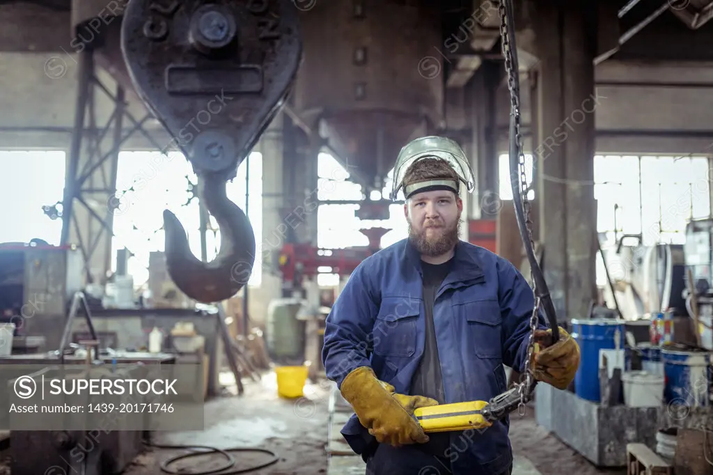 Portrait of apprentice foundry worker in iron foundry