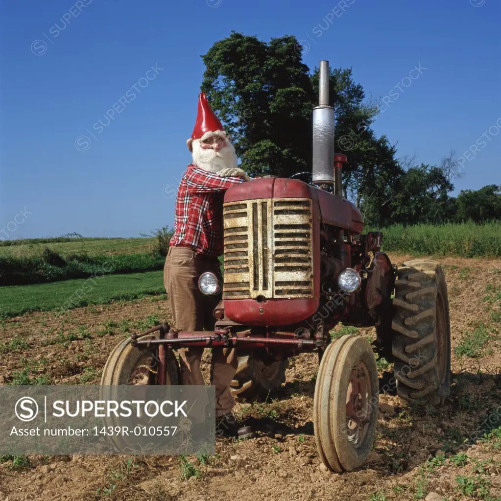 Gnome leaning on a tractor 
