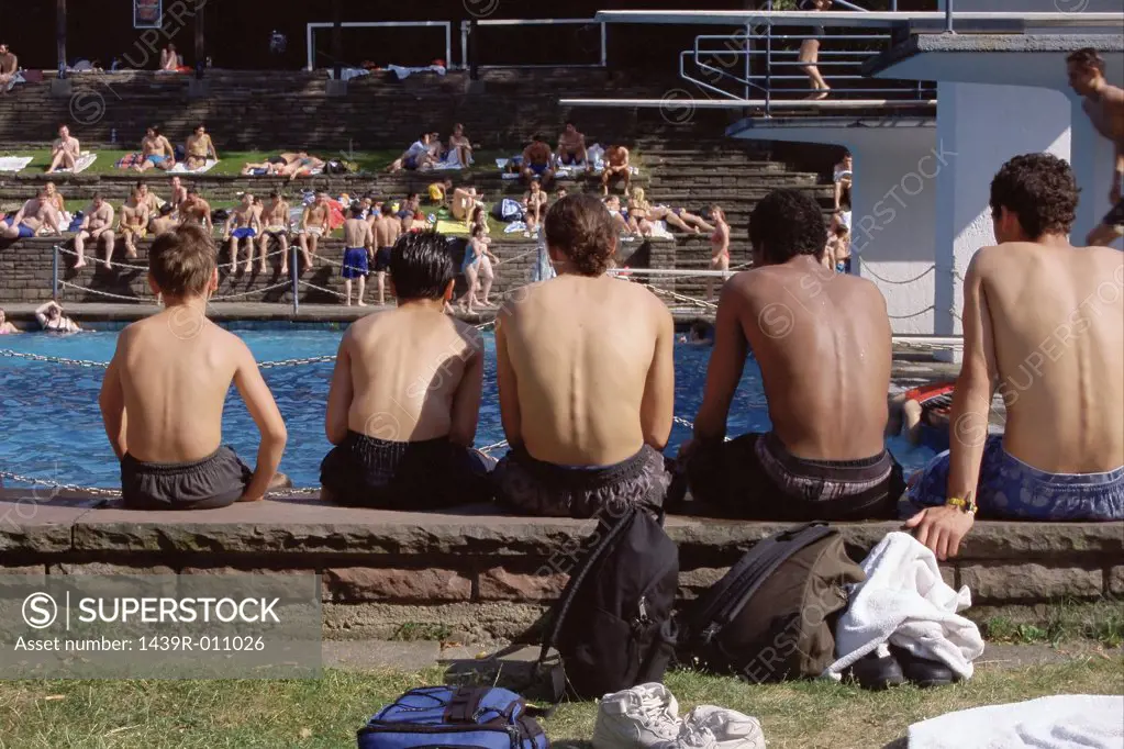 Teenage boys waiting by pool