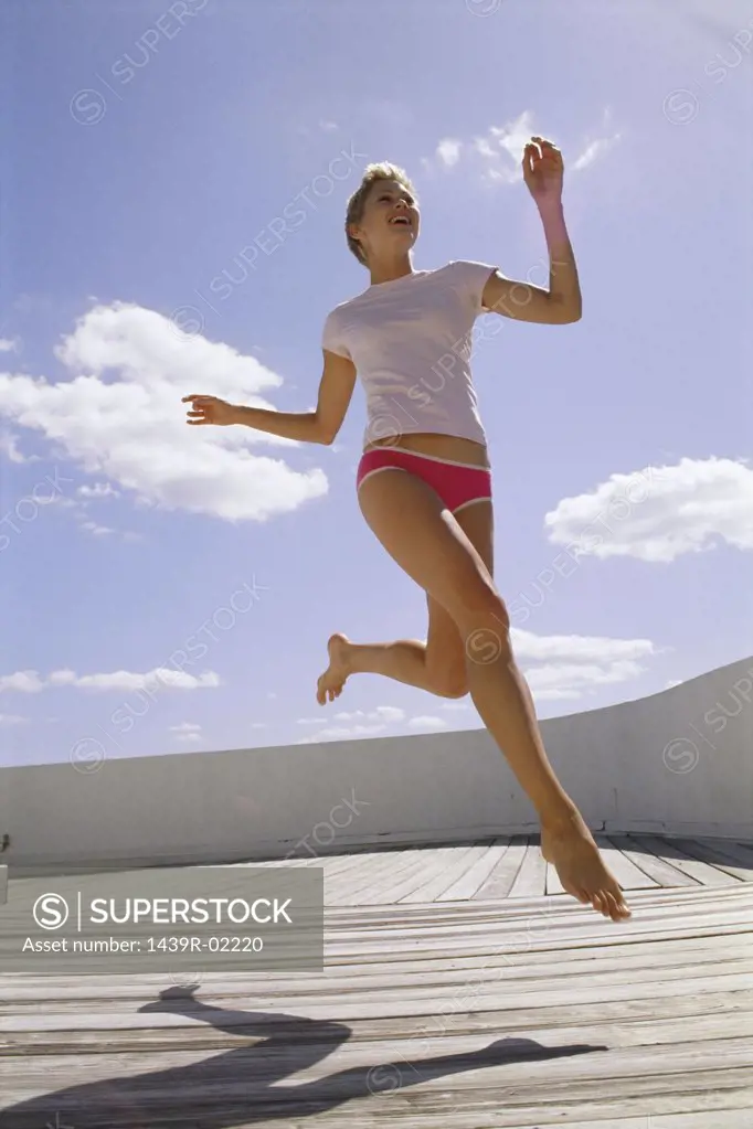 Woman running on decking