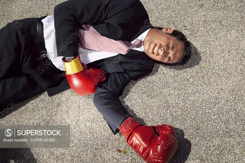 Businessman unconscious on floor