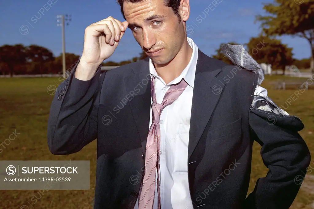 Businessman with a torn suit
