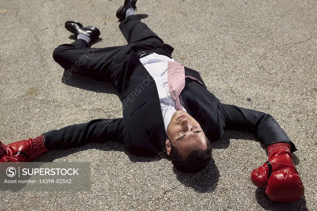 Businessman unconscious on floor