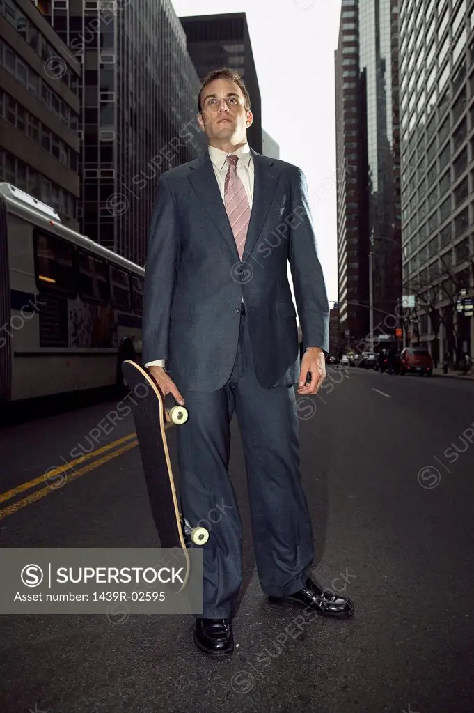 Businessman with a skateboard