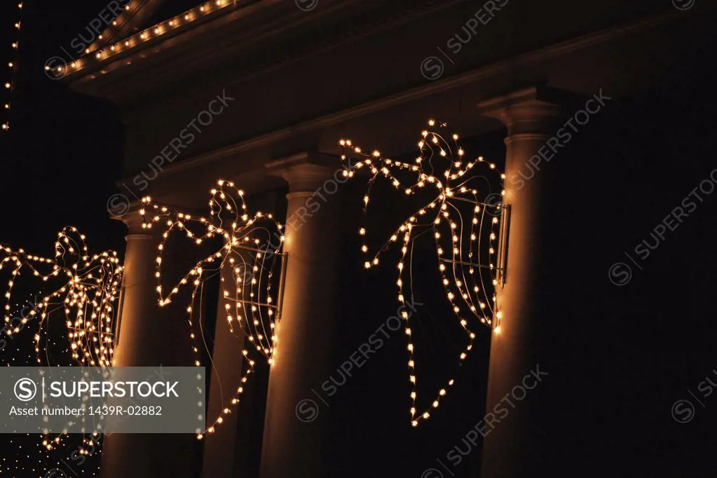 Illuminated angels on column