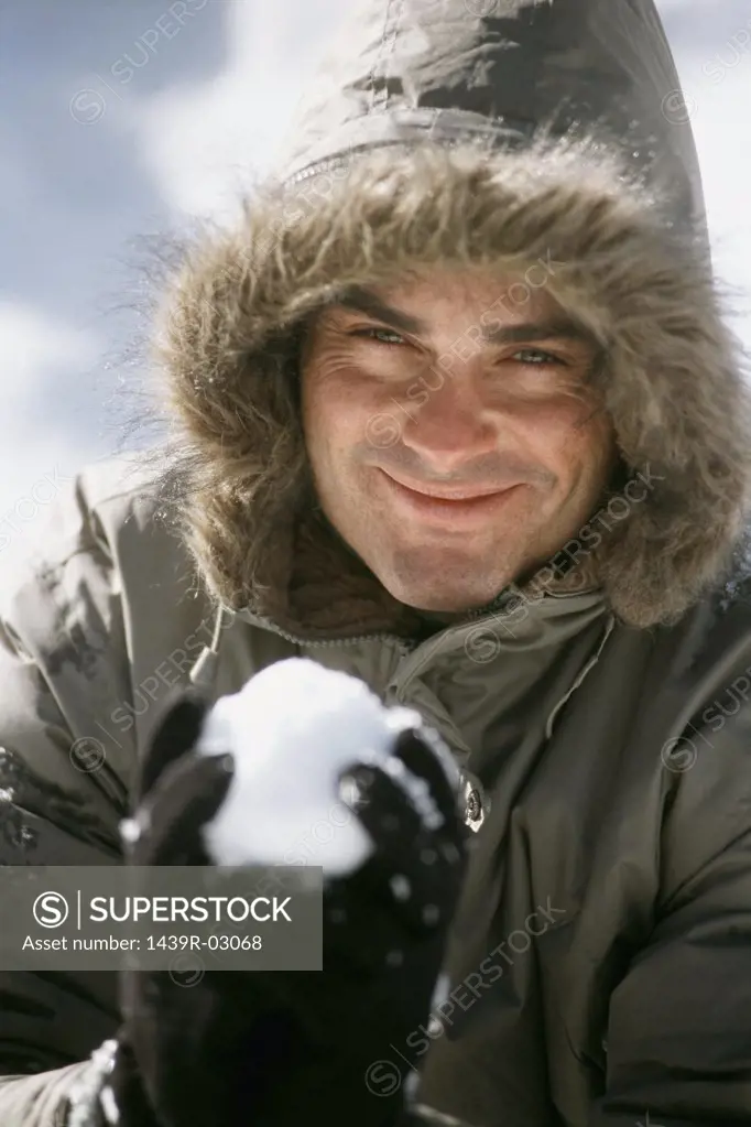 Man holding a snowball