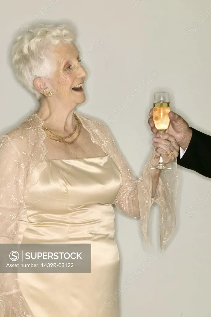 Senior woman with glass of champagne