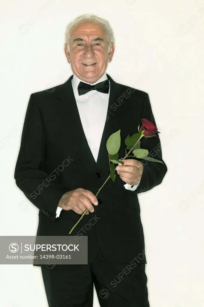 Senior man holding a rose