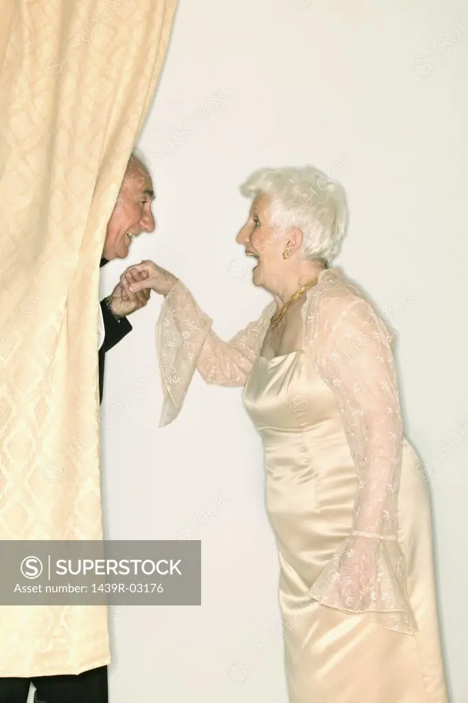 Man kissing a senior womans hand