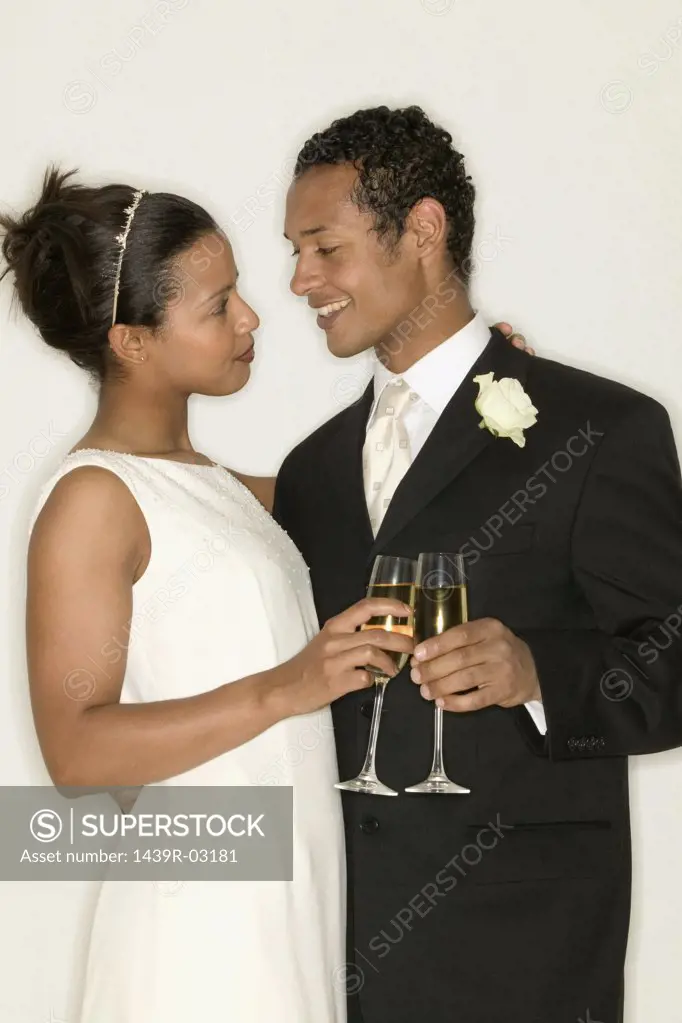 Newlyweds drinking champagne