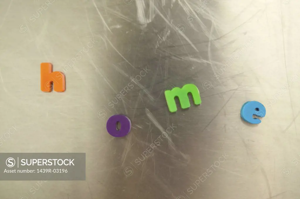 Letter magnets on refrigerator