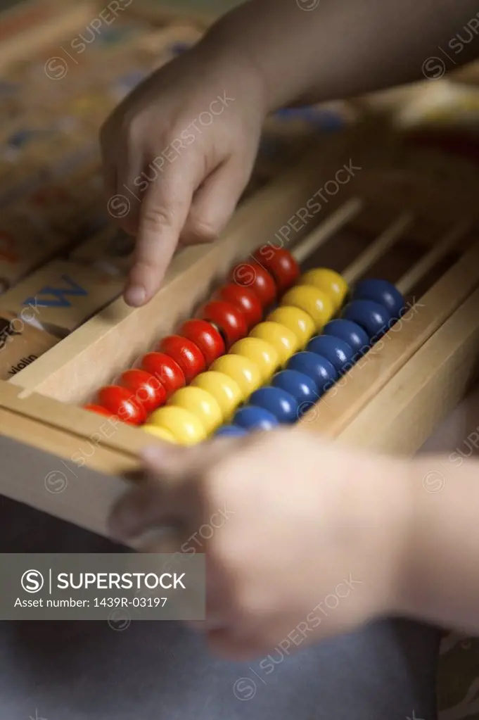 Child using an abacus