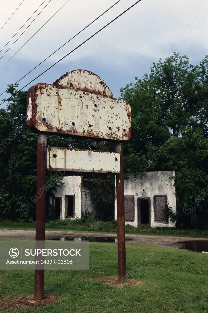 Rusting sign near building