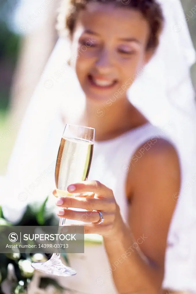 Bride having champagne