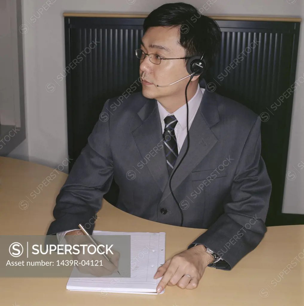 Businessman wearing telephone headset