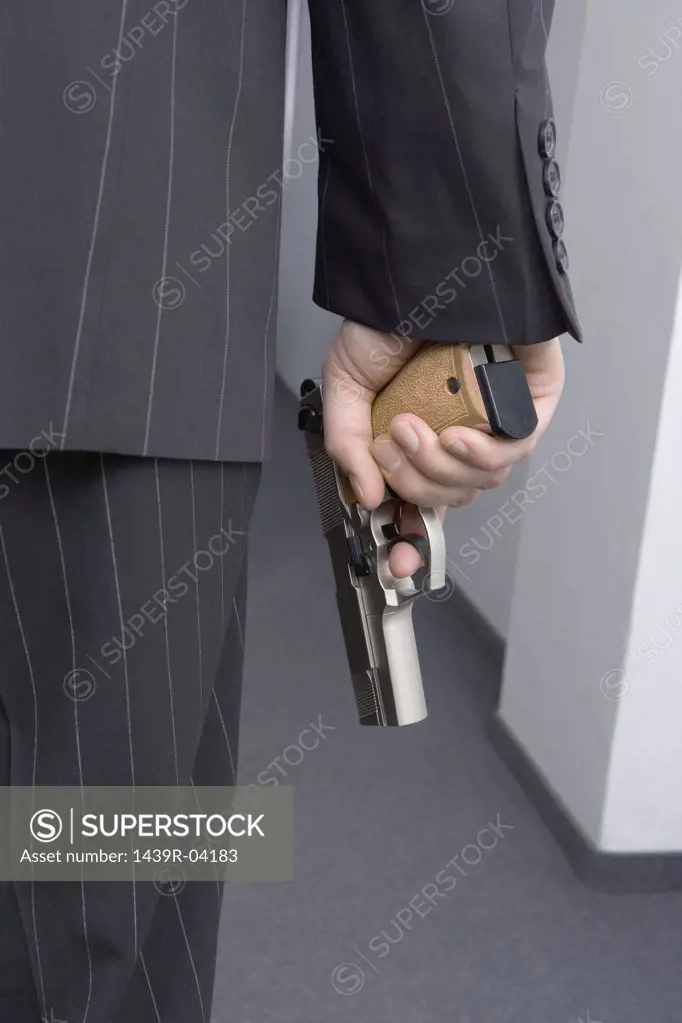 Businessman holding a handgun