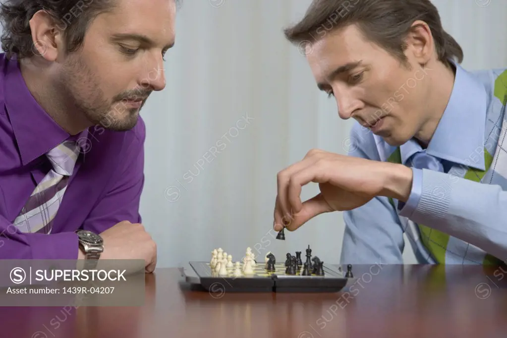 Office workers playing chess
