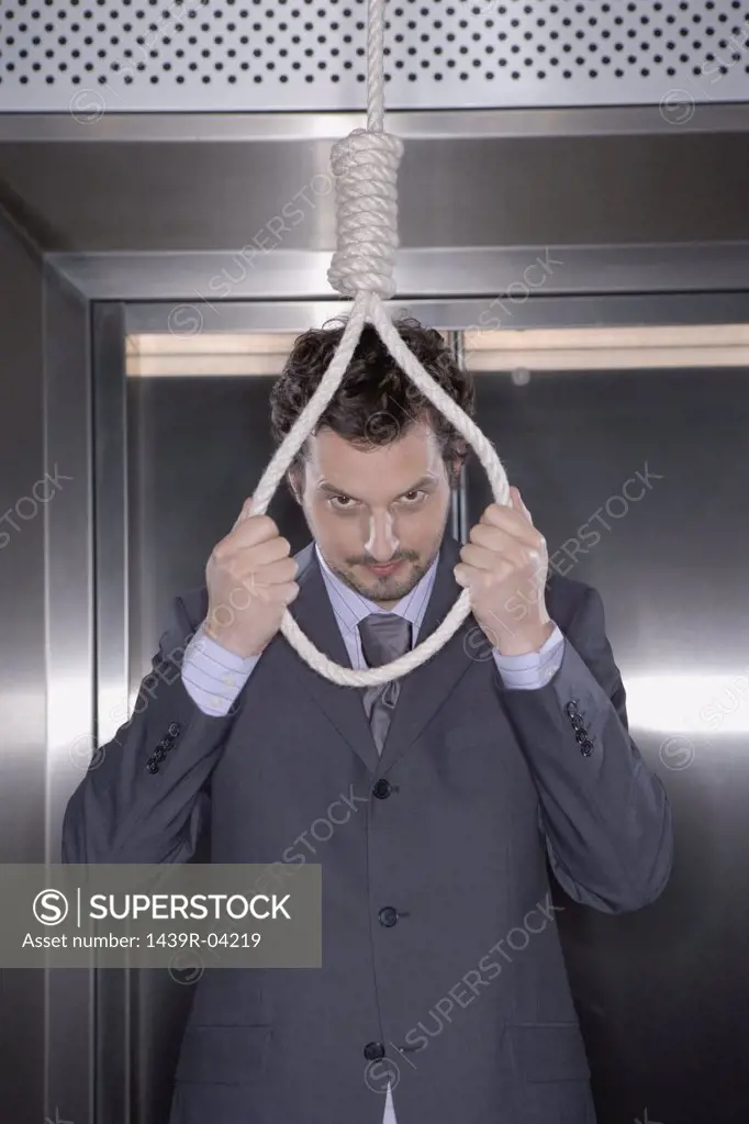 Businessman with noose around neck