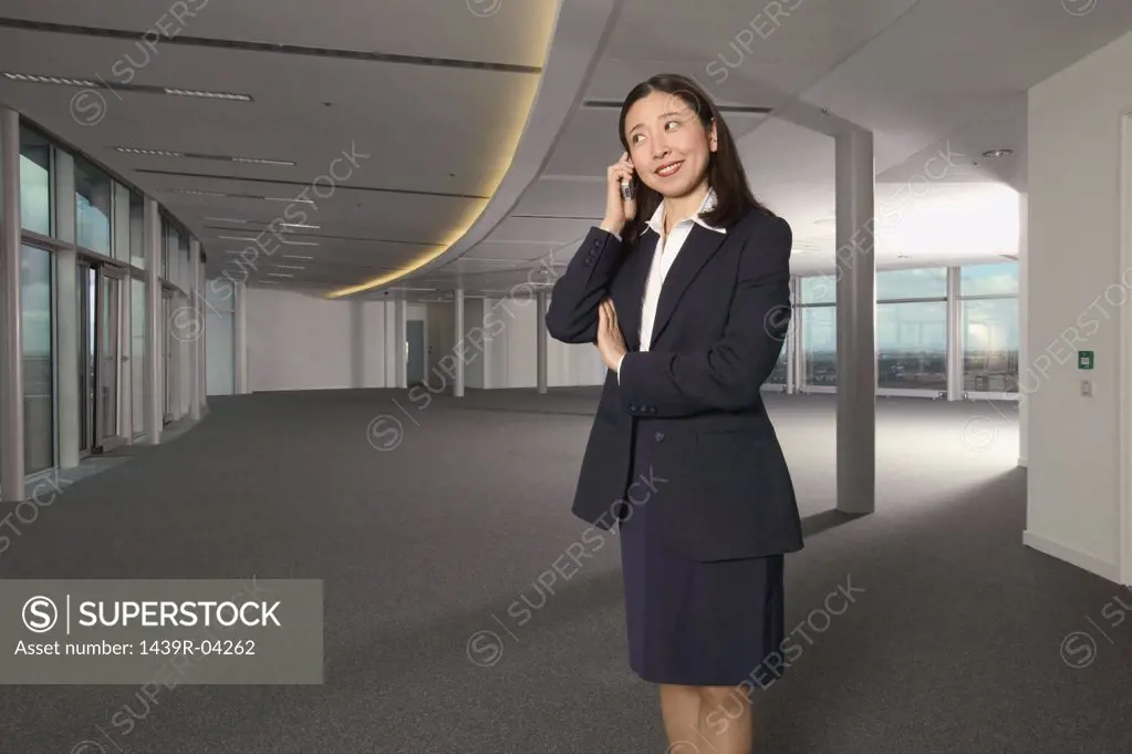 Businesswoman using a cellular telephone