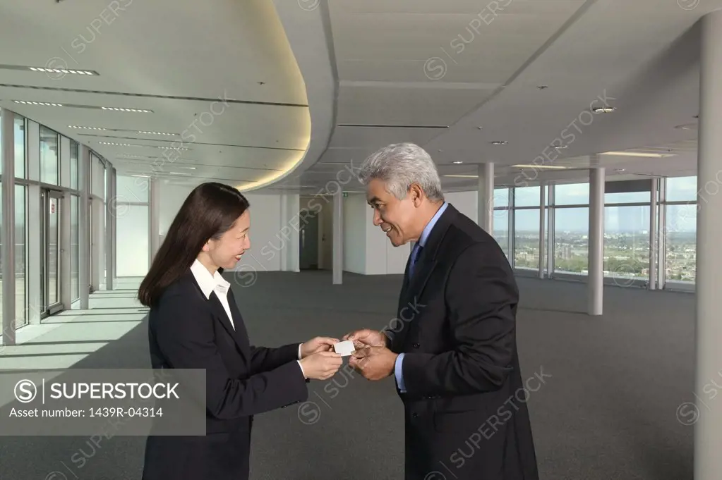 Businesspeople exchanging business cards