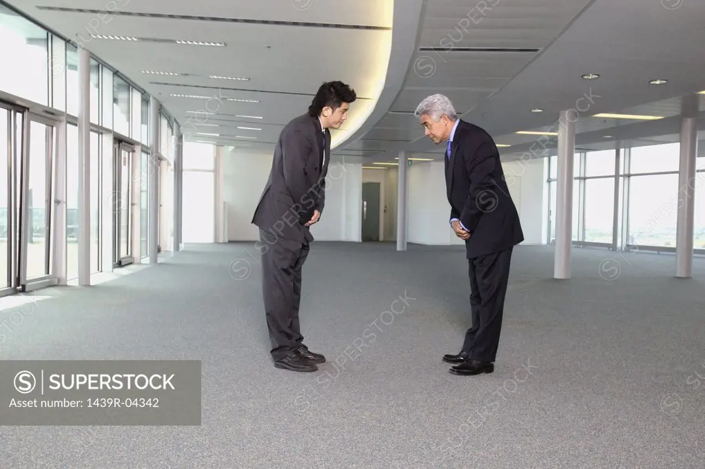 Asian businessmen bowing