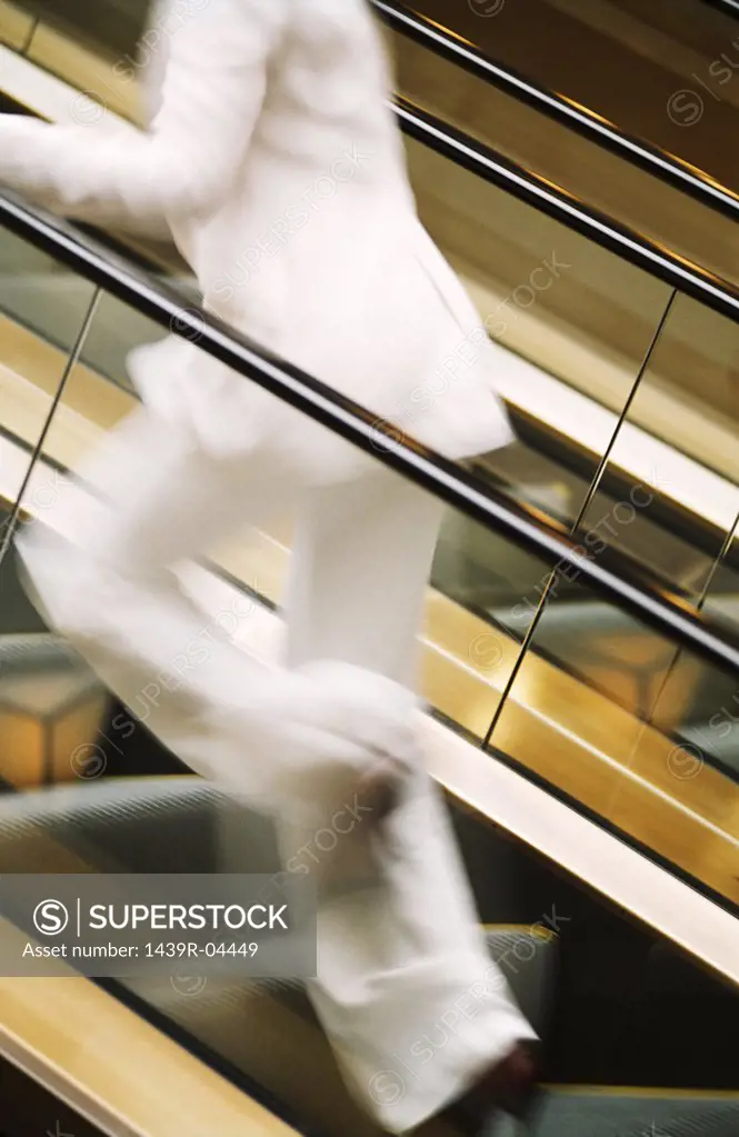 Woman running up stairway