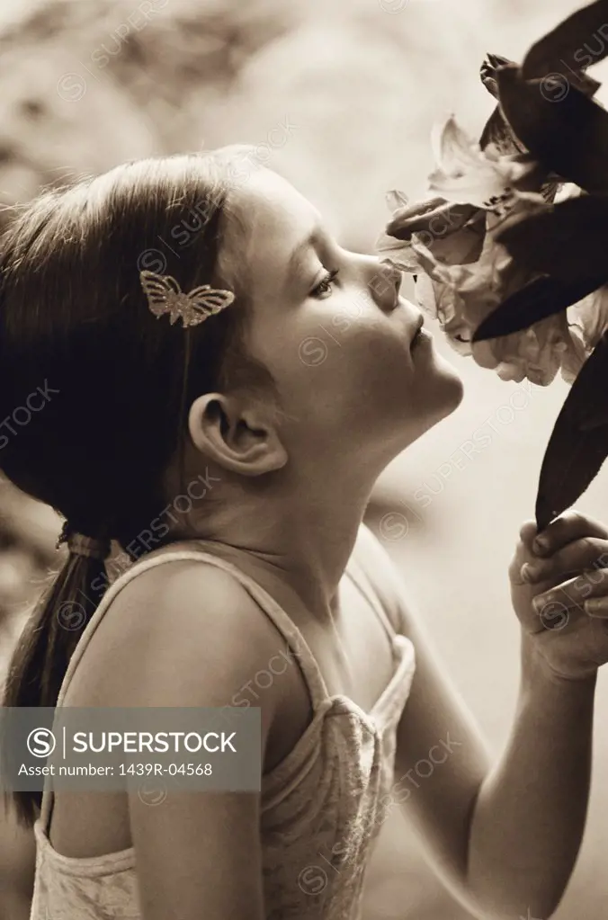 Ballerina sniffing a flower
