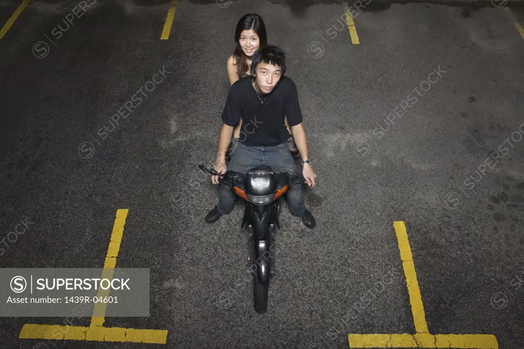 Young couple on a moped