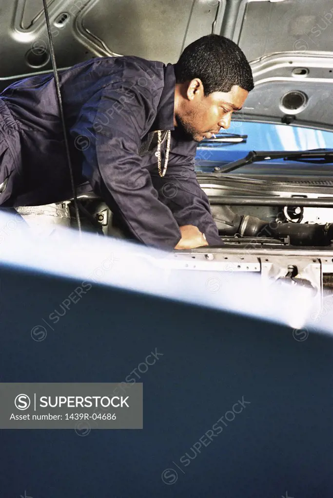 Mechanic working on engine