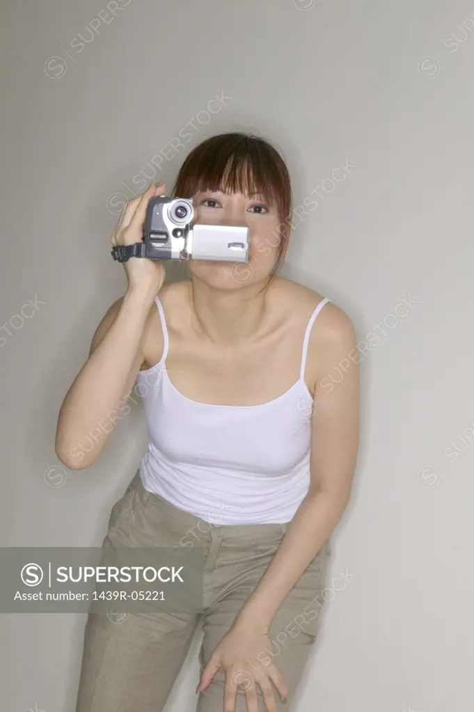 Woman using a video camera
