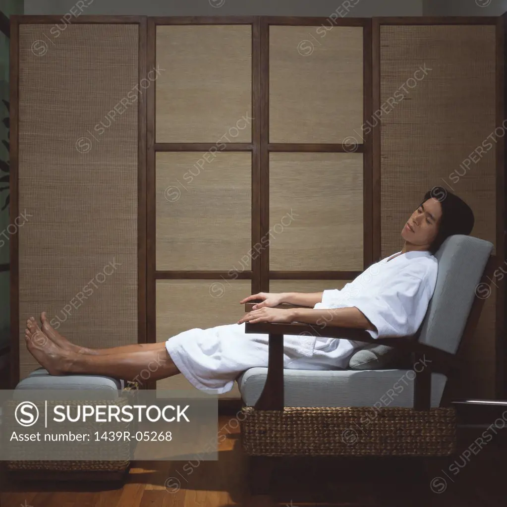 Asian man sleeping in spa