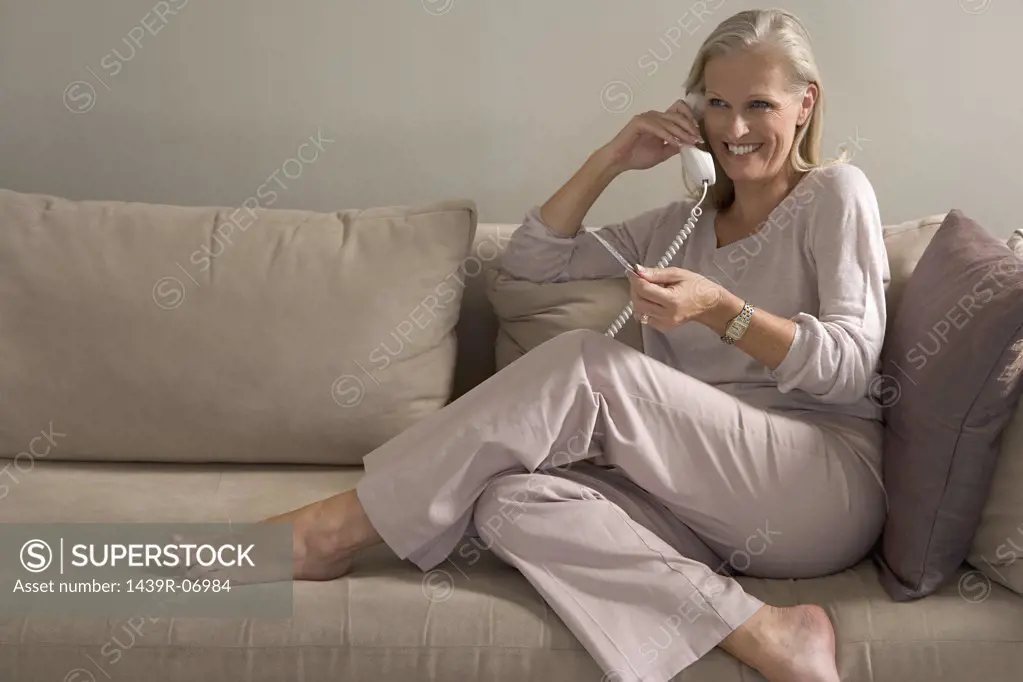 Woman on phone holding credit card