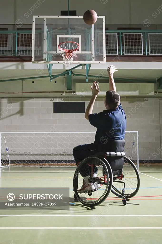 Disabled man playing basketball