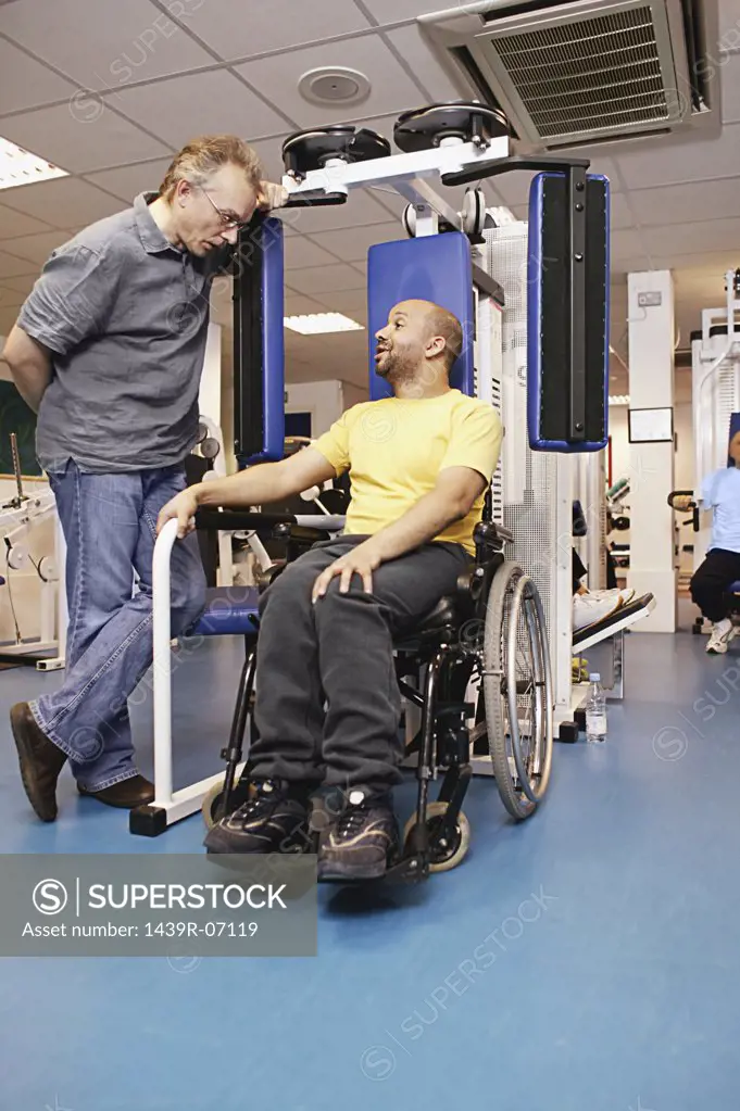 Disabled man using gymnasium