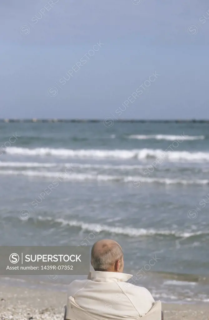 Senior man looking at waves
