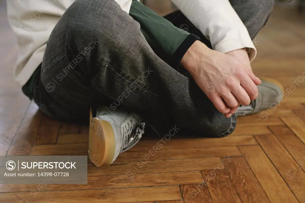 Man sitting cross-legged on the floor