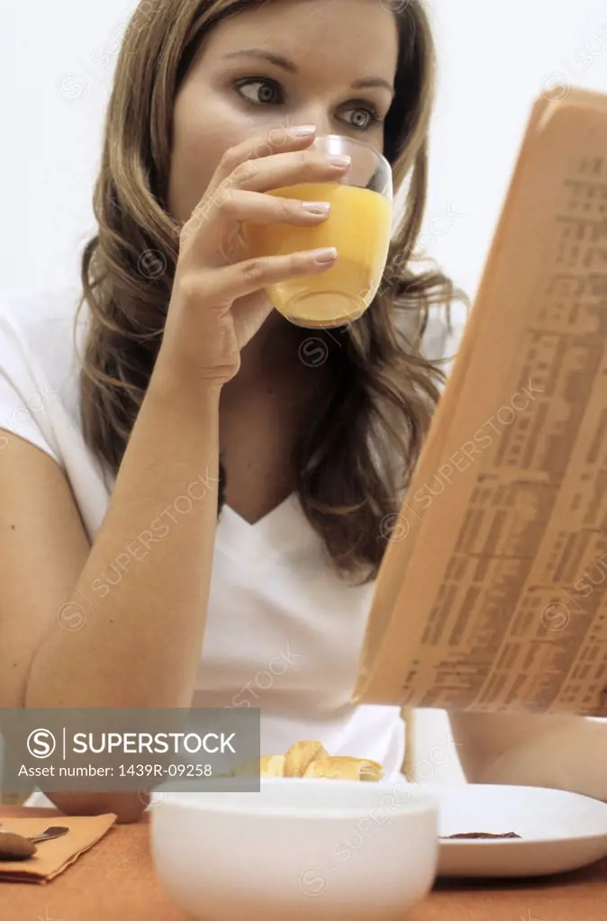 Woman reading at breakfast
