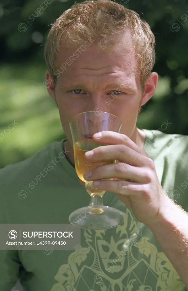 Young male drinking from glass