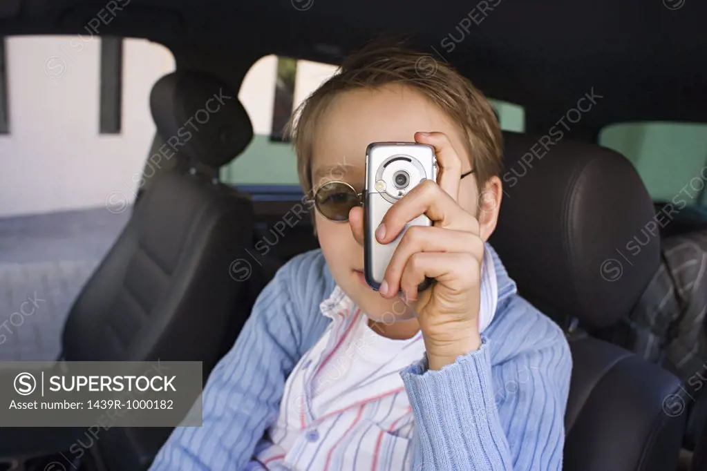 Boy with camera phone
