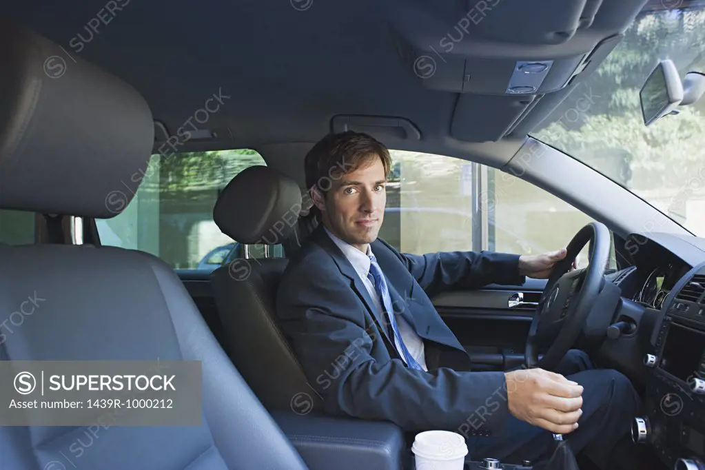 Businessman driving car