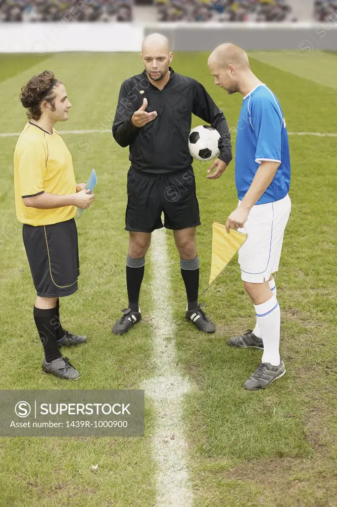 Referee tossing a coin