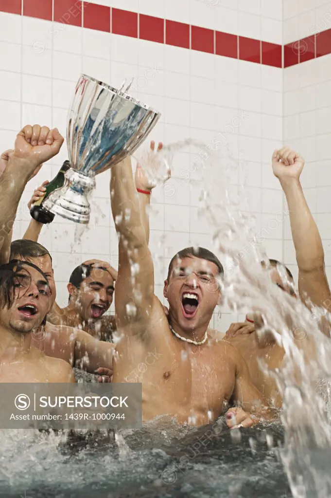 Winning football team in the bath